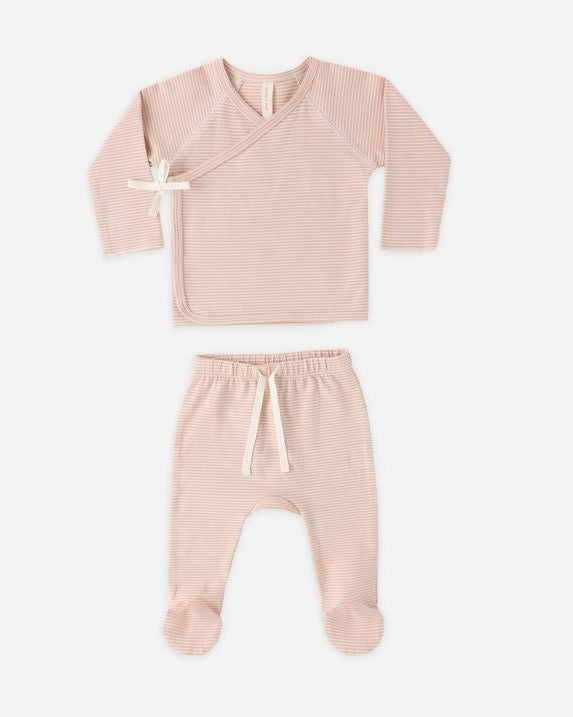 Pink baby outfit with top and pants on a white background