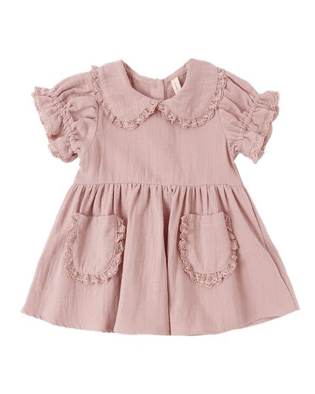 Pink dress with ruffled collar and pockets on a white background