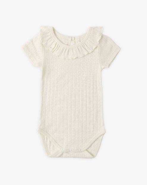Baby romper with ruffled neckline on a white background