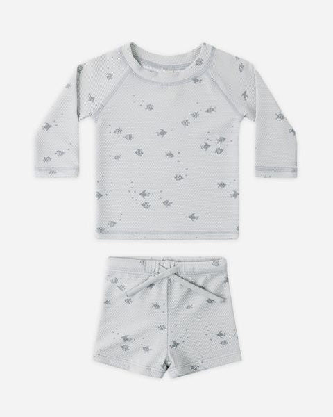 Children's two-piece set with long-sleeve top and shorts on a white background