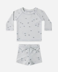 Children's two-piece set with long-sleeve top and shorts on a white background