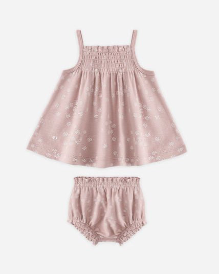 Pink baby dress and bloomers set on a white background