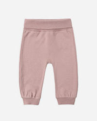 Pink baby pants on a white background