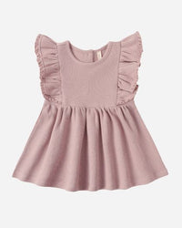 Pink dress with ruffled sleeves on a white background