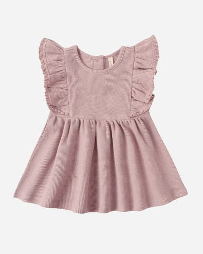 Pink dress with ruffled sleeves on a white background