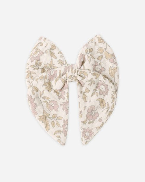 Floral patterned bow on a white background