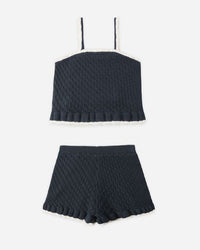 Black ribbed crop top and shorts set on a white background