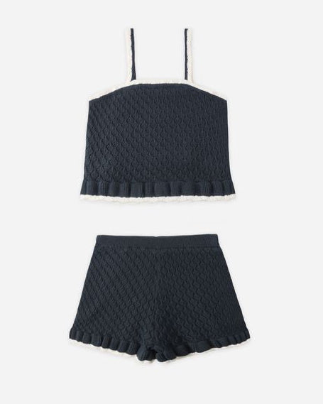 Black ribbed crop top and shorts set on a white background