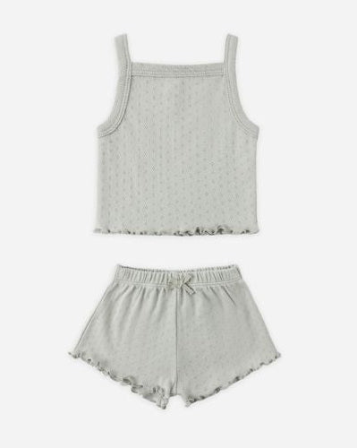 Light gray tank top and shorts set on a white background