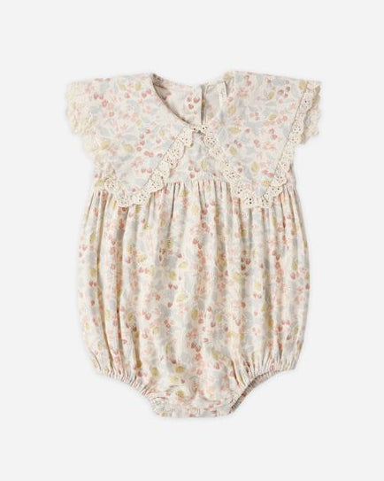 Baby romper with floral pattern on a white background