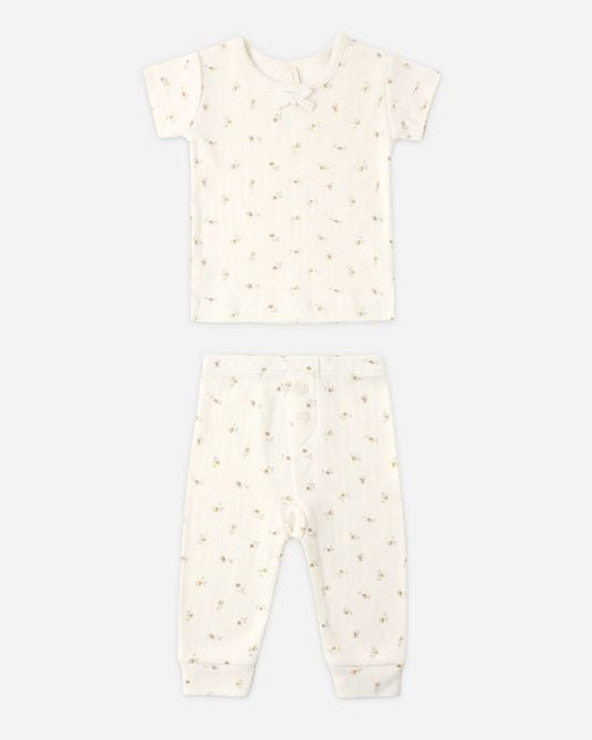 Baby onesie with a subtle pattern on a white background