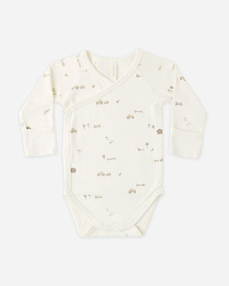 Baby onesie with long sleeves on a white background