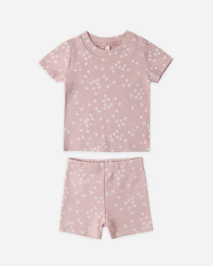 Pink children's pajama set with star pattern on a white background