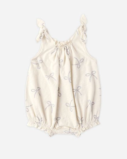 White baby romper with floral patterns on a white background