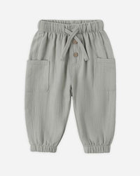 Light gray children's pants with a drawstring on a white background
