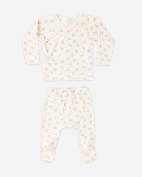Baby outfit with matching headband on a white background