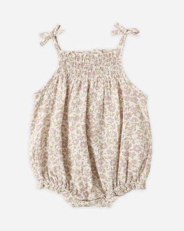 Baby romper with floral pattern on a white background