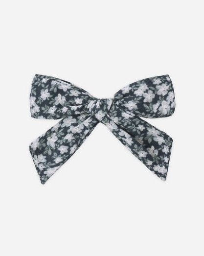 Floral patterned bow on a white background