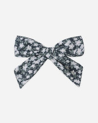 Floral patterned bow on a white background