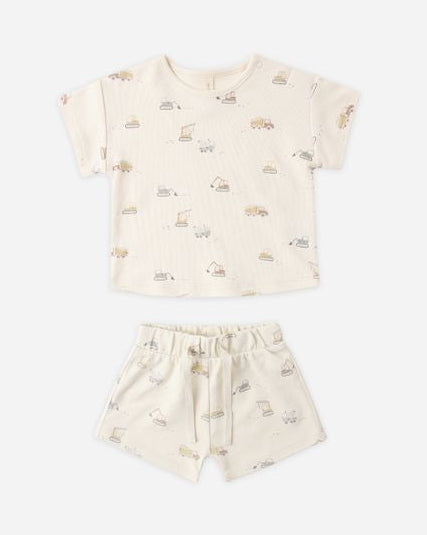 Children's outfit with a cream-colored t-shirt and shorts featuring a subtle pattern on a white background.