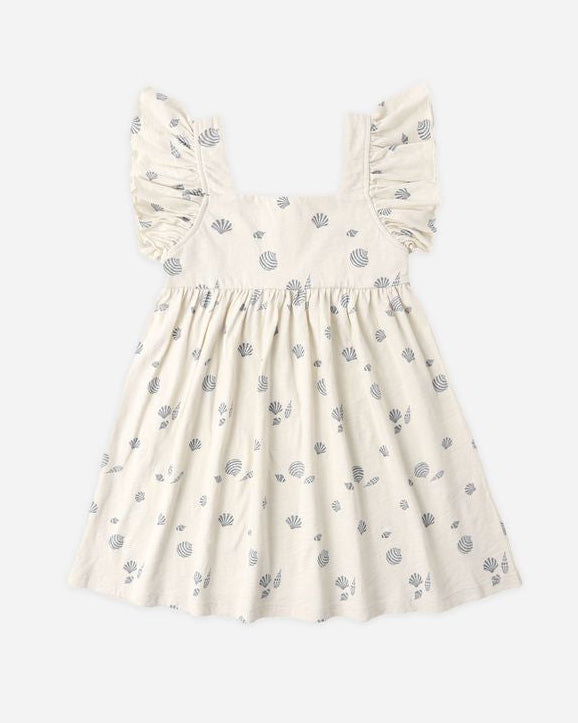 White dress with blue floral pattern on a white background