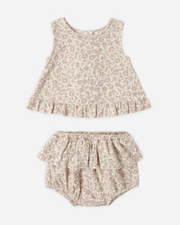 Floral baby outfit with top and bloomers on a white background