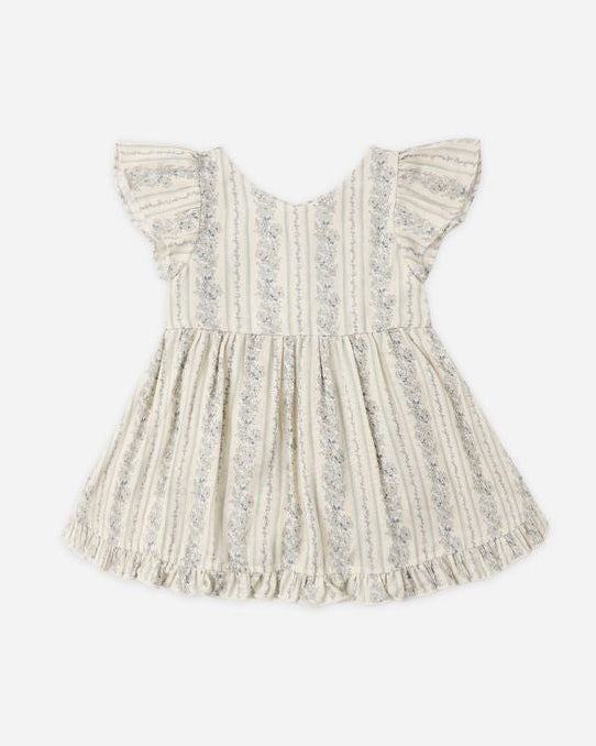 White lace dress on a light beige background