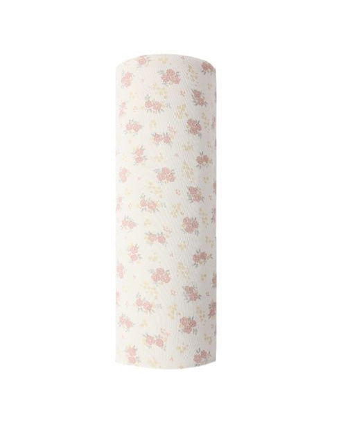 Roll of white fabric with pink floral pattern on a white background