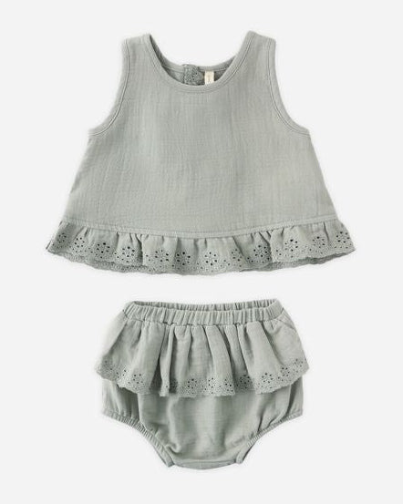 Gray baby outfit with top and bloomers on a white background