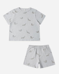 Children's set with a patterned t-shirt and shorts on a white background