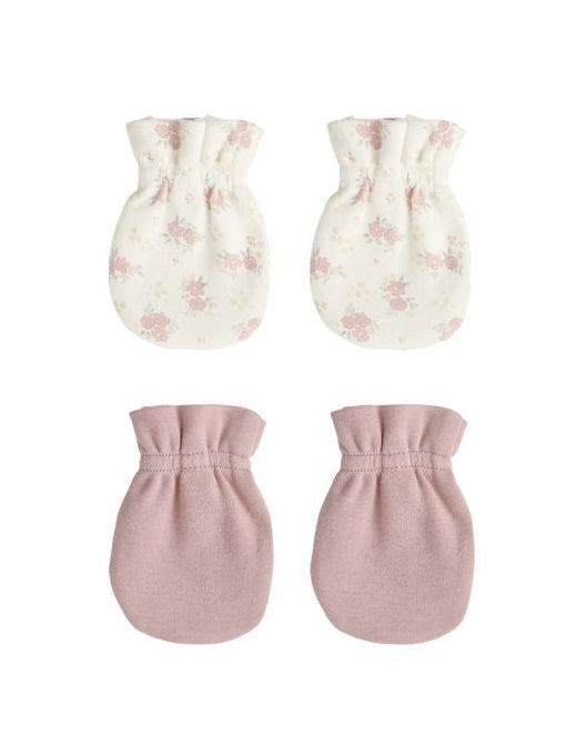 Set of four baby mittens with floral and solid designs on a white background