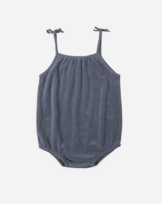 Gray baby romper with thin straps on a white background