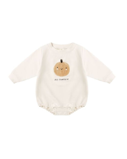 Baby romper with pumpkin design and text on a white background