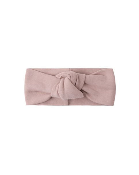 Pink headband with a knot on a white background