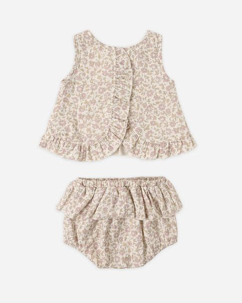 Floral baby outfit with top and bloomers on a white background