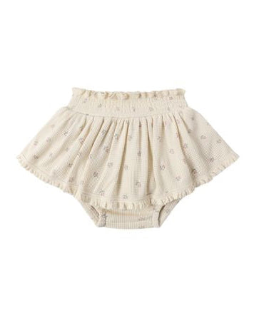 Beige baby bloomers on a white background