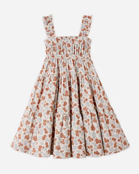 Floral dress with smocked bodice on a white background