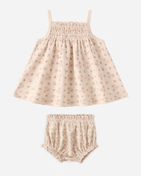 Children's dress and bloomers set with a subtle pattern on a white background