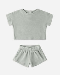 Gray t-shirt and shorts set on a white background