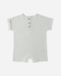 Striped baby romper on a white background