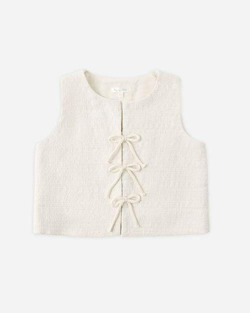 White baby vest with lace details on a white background