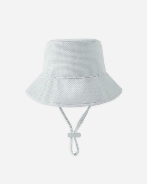 Light blue bucket hat with a tie on a white background